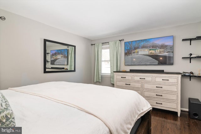 bedroom featuring dark wood-type flooring