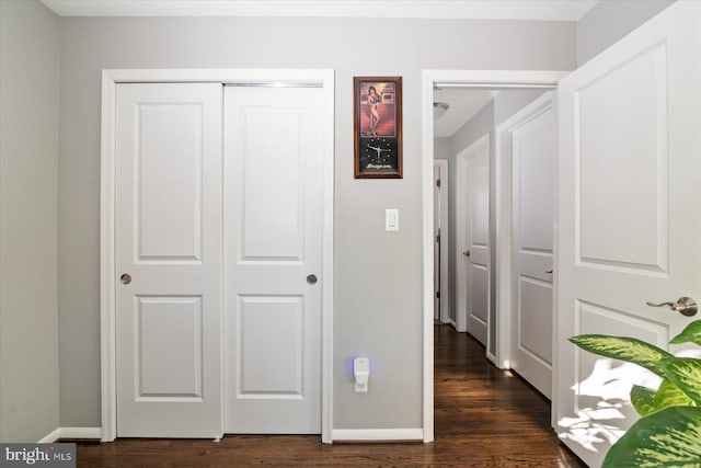 hall with dark hardwood / wood-style floors