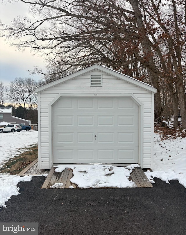 view of snow covered garage