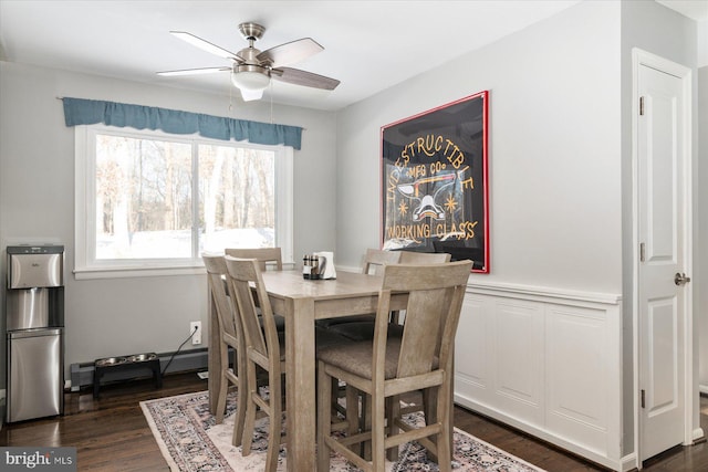 dining room with ceiling fan, dark wood-type flooring, and baseboard heating