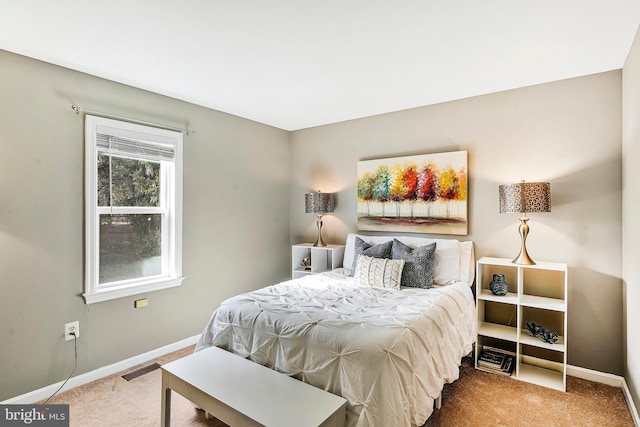 bedroom featuring carpet, visible vents, and baseboards