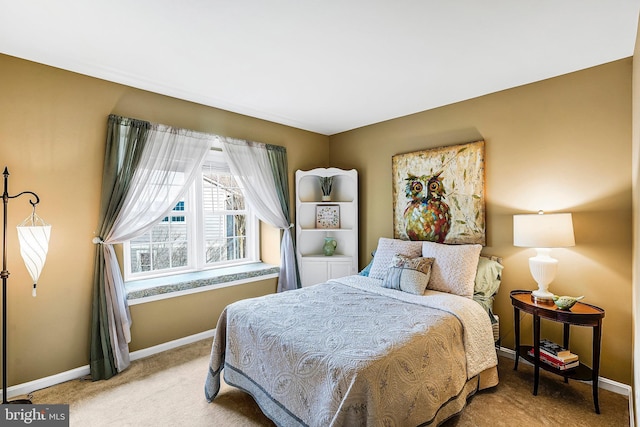 bedroom featuring baseboards and light colored carpet