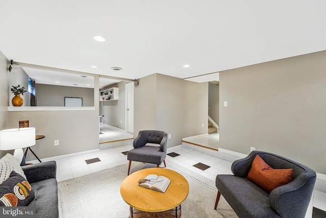 living room featuring stairs, light tile patterned floors, baseboards, and recessed lighting