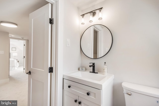 half bath with vanity and toilet