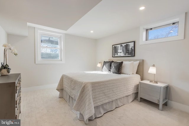 bedroom with light carpet, recessed lighting, and baseboards