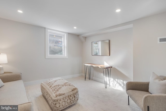 sitting room with recessed lighting, visible vents, and baseboards