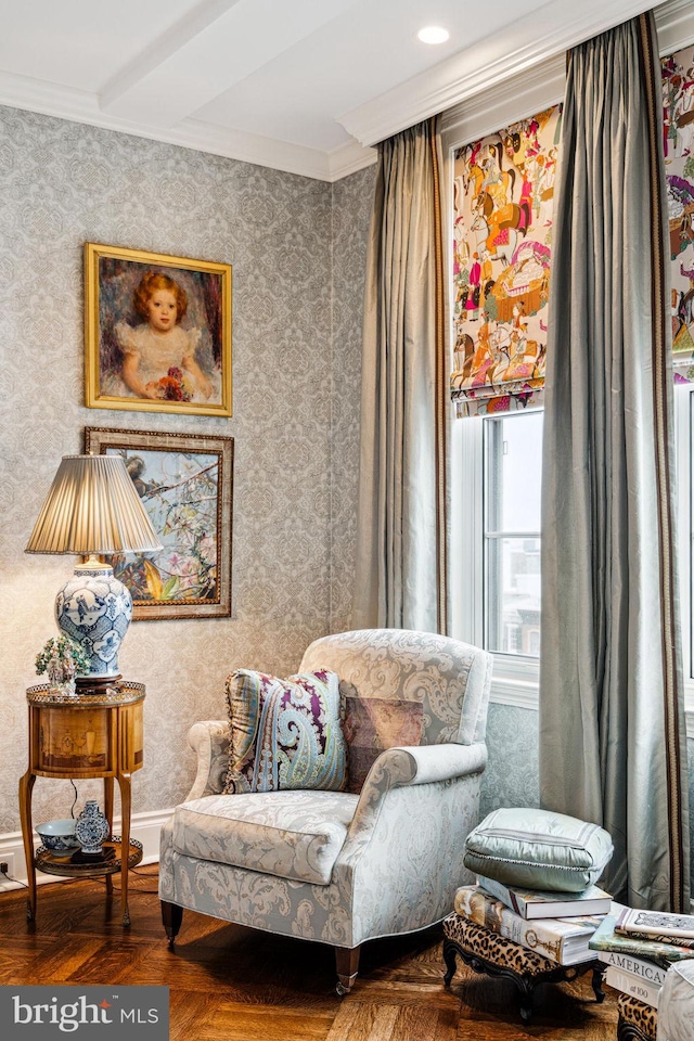 sitting room featuring ornamental molding and parquet flooring