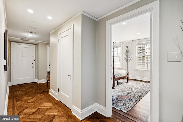 hall featuring crown molding and dark parquet flooring