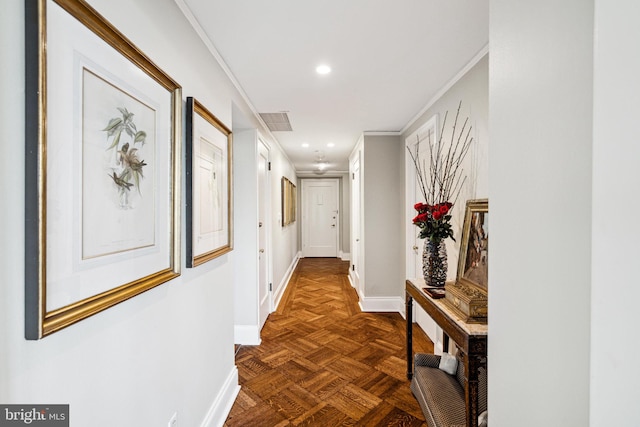 corridor with dark parquet flooring and crown molding