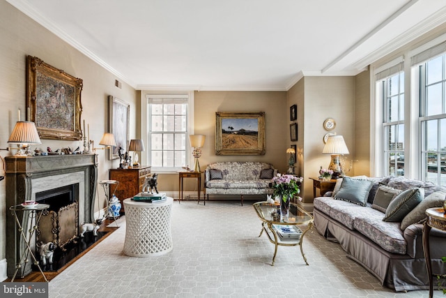 living room with a fireplace and crown molding