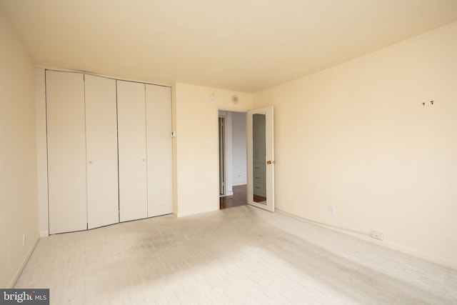 unfurnished bedroom featuring a closet