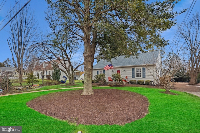 ranch-style house with a front lawn