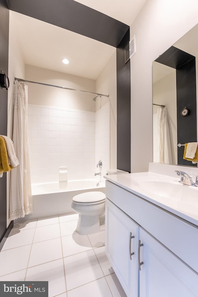 bathroom with visible vents, toilet, tile patterned flooring, shower / bath combination with curtain, and vanity