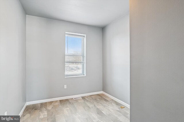 empty room with light wood-type flooring