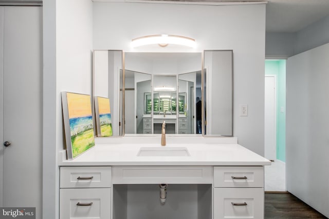 bathroom with vanity and hardwood / wood-style floors