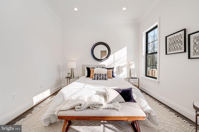 bedroom featuring wood-type flooring and crown molding