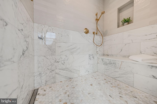 bathroom featuring tiled shower