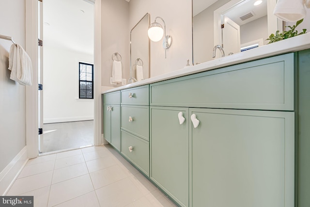 bathroom with vanity and tile patterned flooring