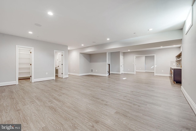 unfurnished living room with light hardwood / wood-style flooring