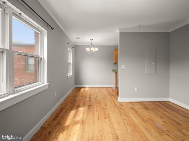 2615 4th St NE Unit 303, Washington, DC 20002 - empty room with a chandelier, ornamental molding, light wood-type flooring, and baseboards