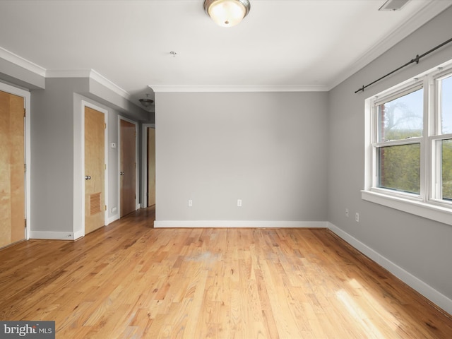 2615 4th St NE Unit 303, Washington, DC 20002 - unfurnished room featuring ornamental molding, light wood-style flooring, and baseboards