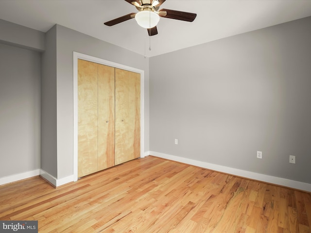 2615 4th St NE Unit 303, Washington, DC 20002 - unfurnished bedroom with wood finished floors, baseboards, a closet, and a ceiling fan