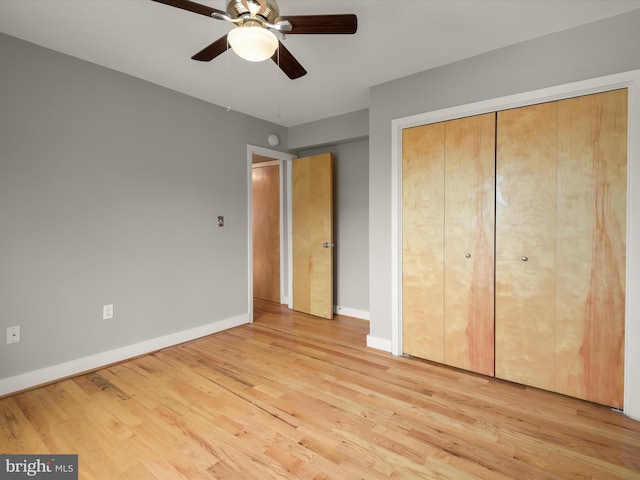 2615 4th St NE Unit 303, Washington, DC 20002 - unfurnished bedroom featuring wood finished floors, baseboards, a ceiling fan, and a closet