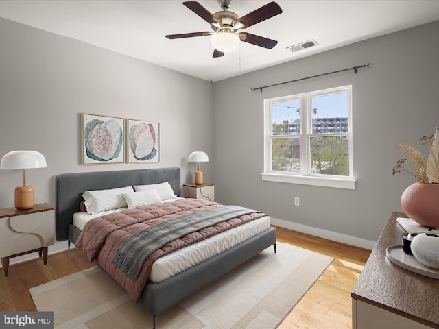 2615 4th St NE Unit 303, Washington, DC 20002 - bedroom featuring light wood finished floors, baseboards, and ceiling fan