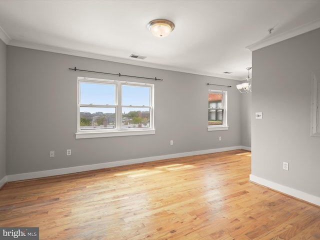 2615 4th St NE Unit 303, Washington, DC 20002 - empty room with ornamental molding, light wood-style flooring, a chandelier, and baseboards