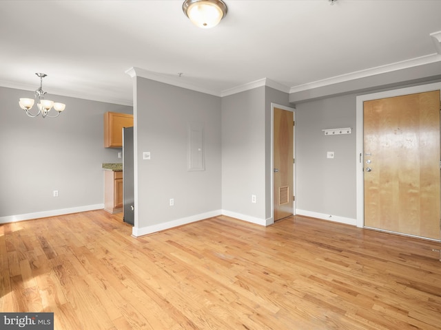 2615 4th St NE Unit 303, Washington, DC 20002 - unfurnished room featuring ornamental molding, a chandelier, light wood-style flooring, and baseboards