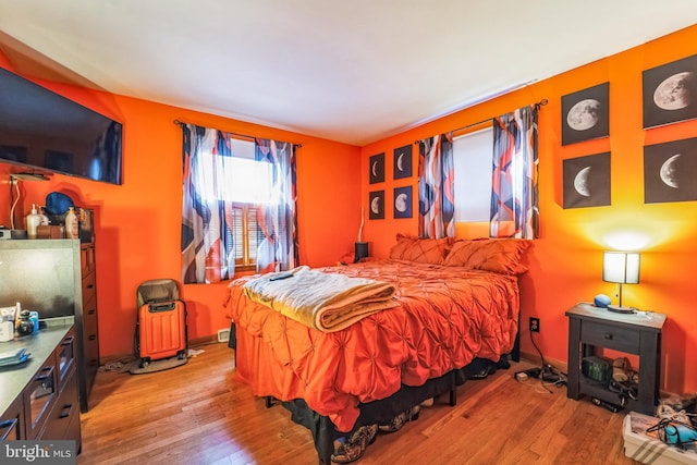 bedroom featuring light wood-type flooring