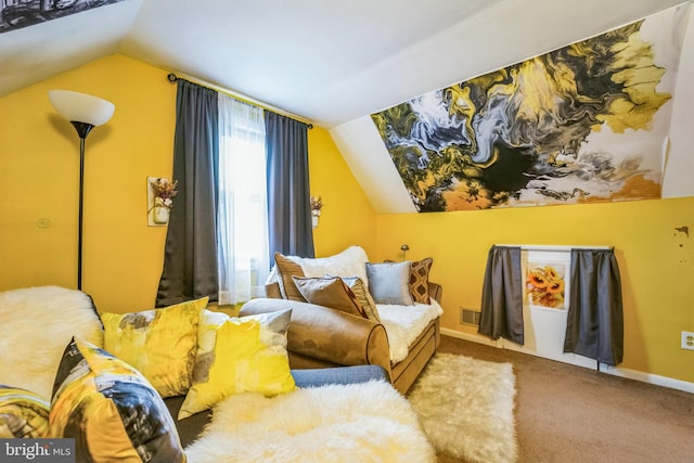 sitting room featuring vaulted ceiling and carpet flooring