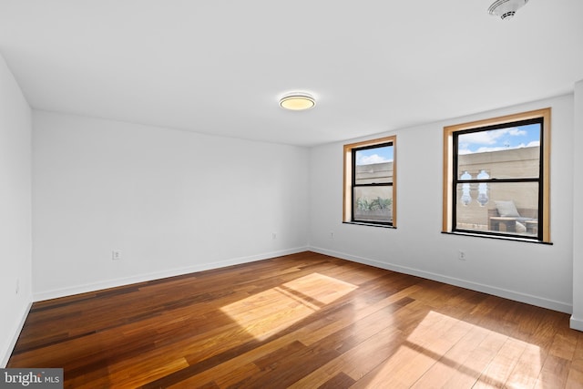 empty room with wood-type flooring