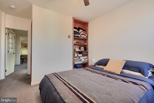 carpeted bedroom with ceiling fan