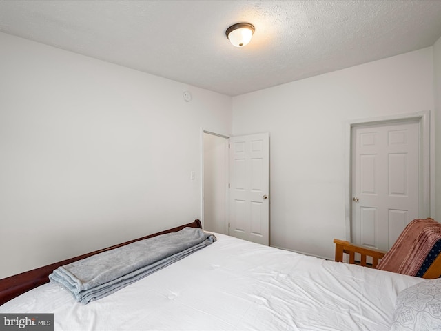 bedroom featuring a textured ceiling