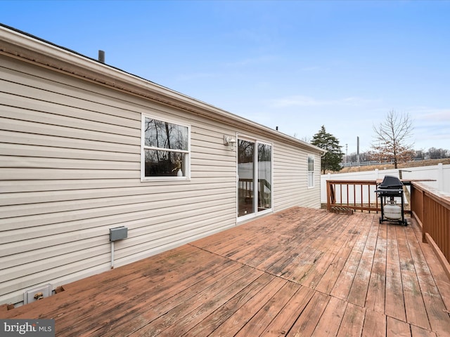 wooden deck with area for grilling