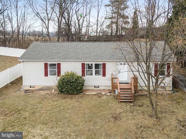 rear view of property with a lawn