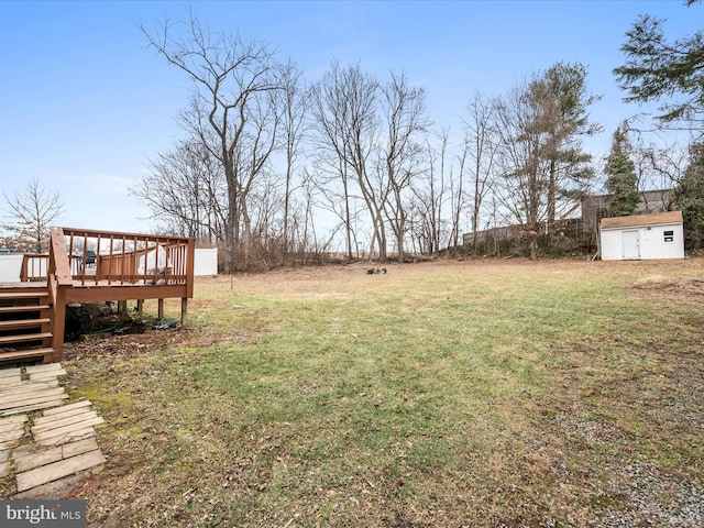 view of yard with a shed and a deck