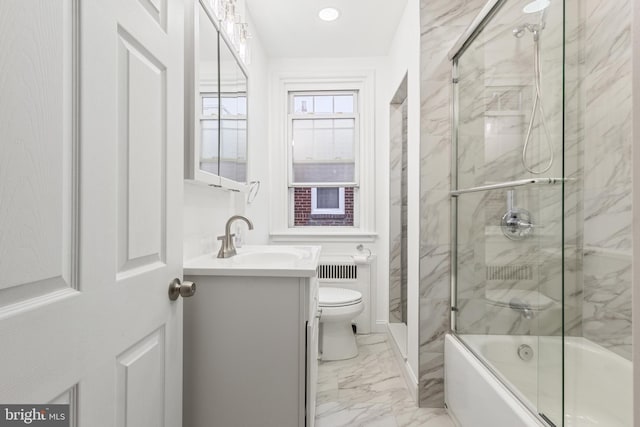 full bathroom with vanity, shower / bath combination with glass door, and toilet