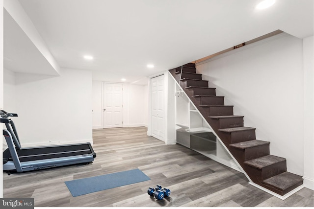 workout room featuring light hardwood / wood-style floors