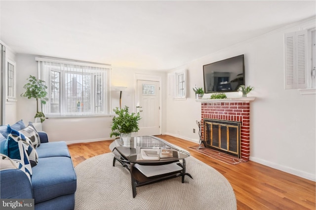 living room featuring hardwood / wood-style floors and a fireplace