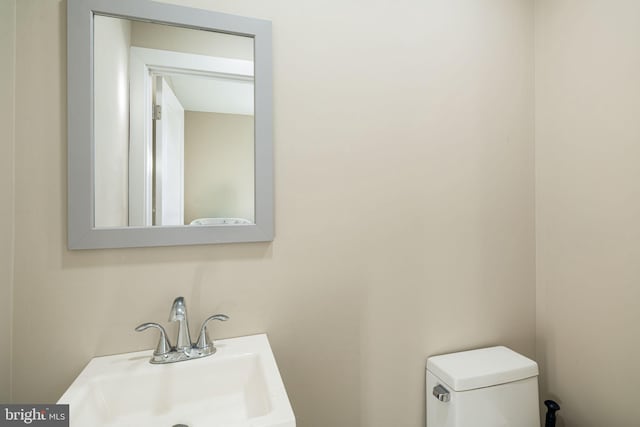 bathroom with sink and toilet