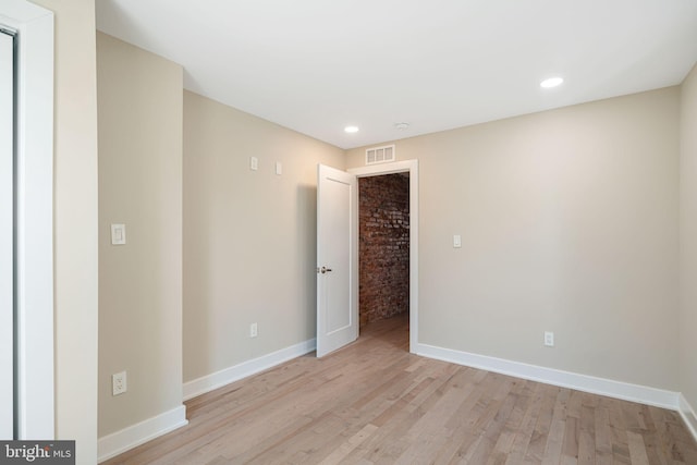 spare room featuring light wood-type flooring