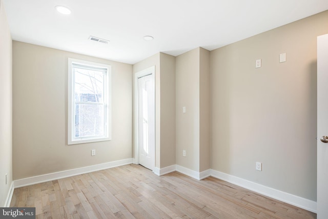 spare room with light hardwood / wood-style floors