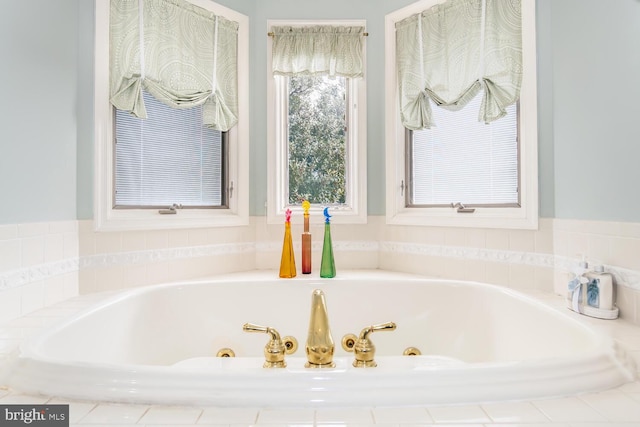 bathroom featuring tiled bath