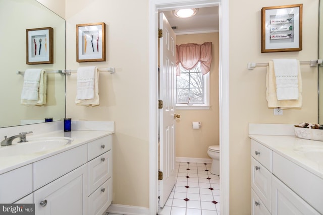 bathroom featuring tile patterned floors, ornamental molding, toilet, and vanity