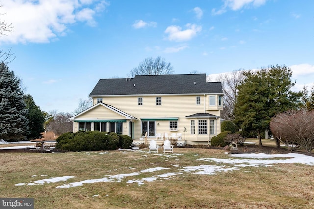 back of house featuring a yard