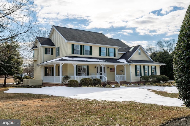 view of front of house featuring a porch and a front lawn