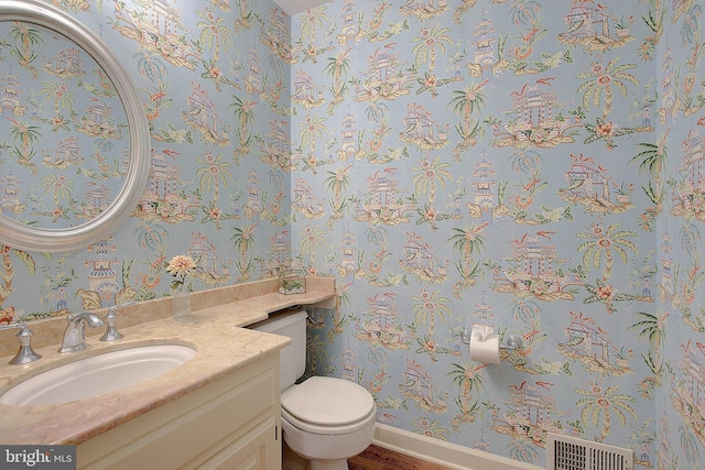 bathroom with vanity and toilet