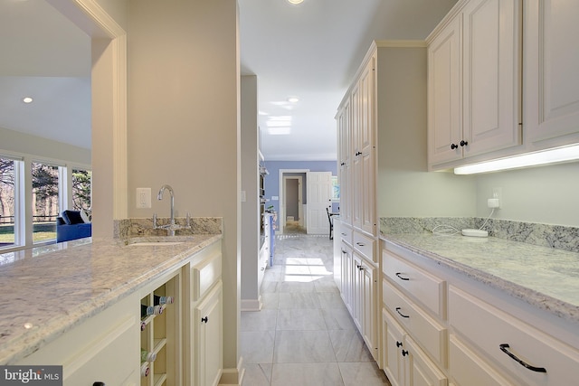 kitchen with sink and light stone counters